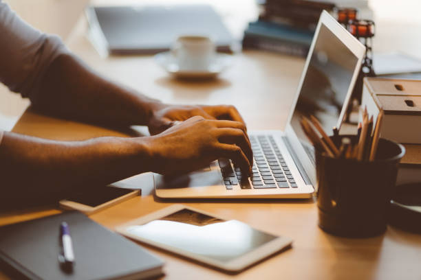 A man trading crypto on his laptop